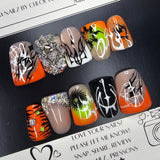 Set of nail art designs on a black surface with a white background