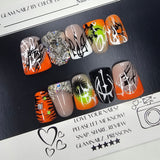 Set of nail art samples with various designs on a black card, featuring a visible brand logo.